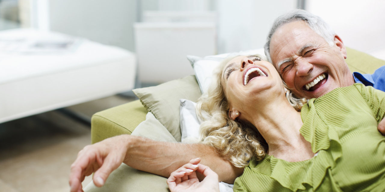 Couple laying on sofa together